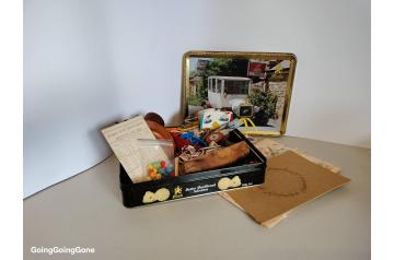 Tin of eclectic knick-knacks